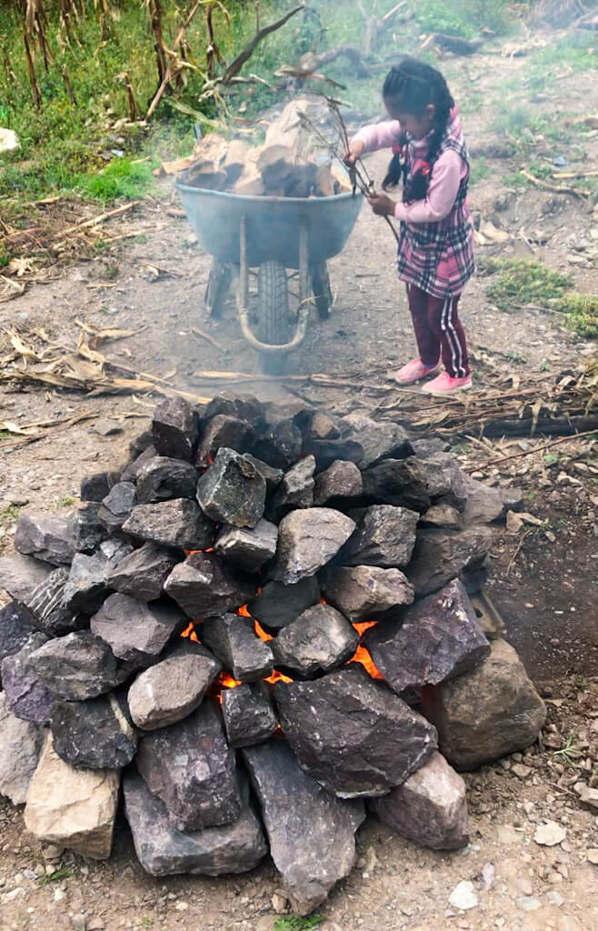 Preparing the rocks for Pachamanca | Kachi Ccata, Peru